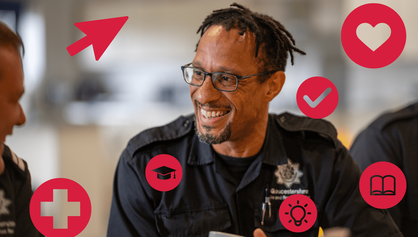 A smiling man in a uniform sits indoors, surrounded by red icons including a heart, check mark, lightbulb, arrow, cross, graduation cap, and open book. He appears to be engaged in a friendly conversation.